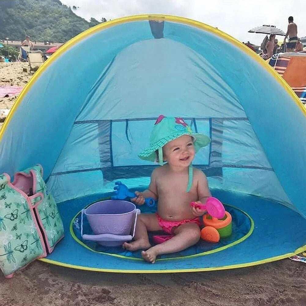 Baby Smiling in Baby Beach Tent 